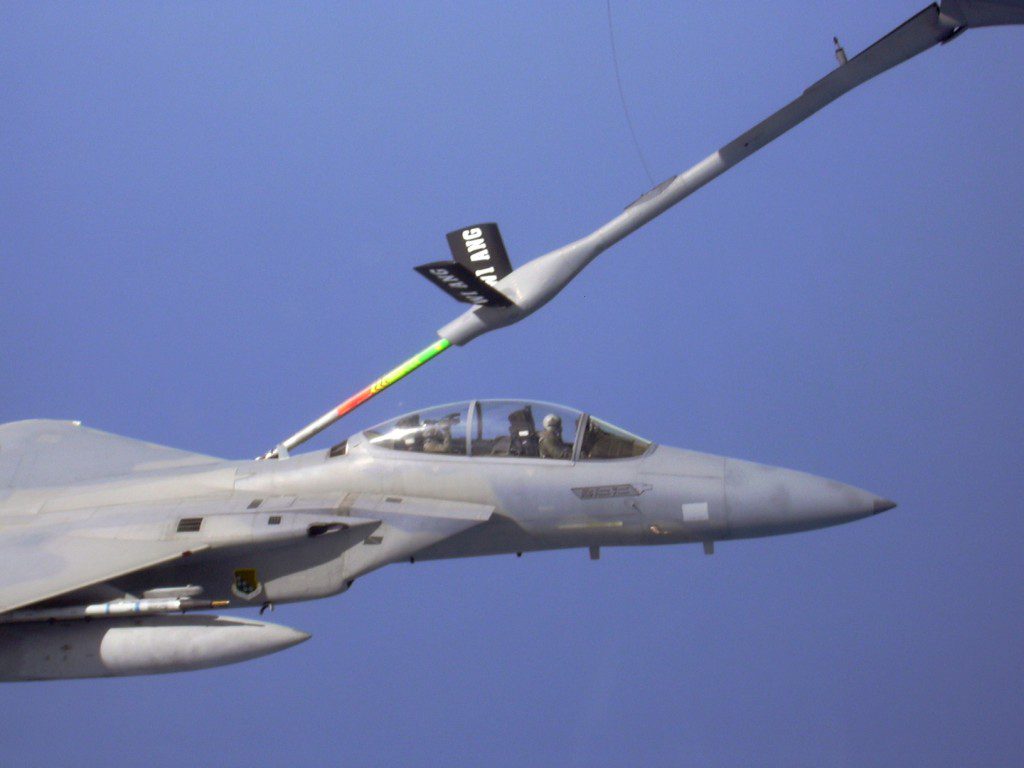 Cameraman Manuel Villeala shoots video of air-to-air refueling from backseat of an F-15 fighter
